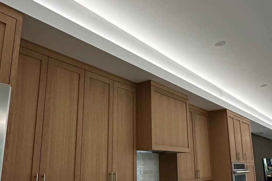 Continuous LED cove lighting and recessed downlights installed in a modern Sonoma County kitchen