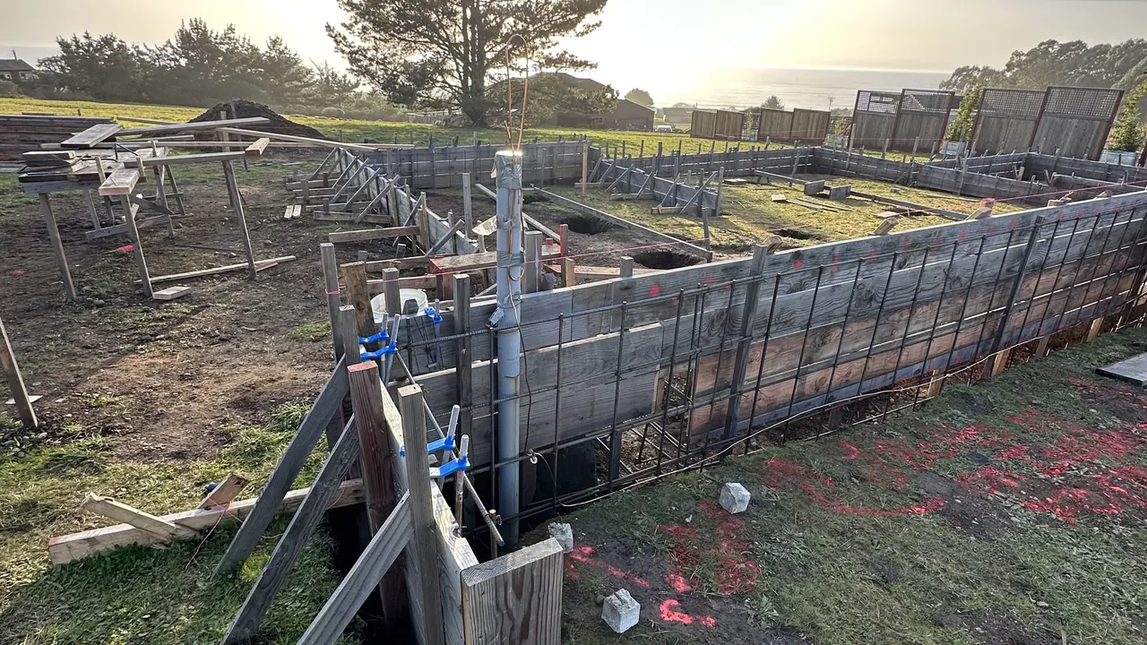 Underground conduit rough-in at a new-construction foundation on the Sonoma coast