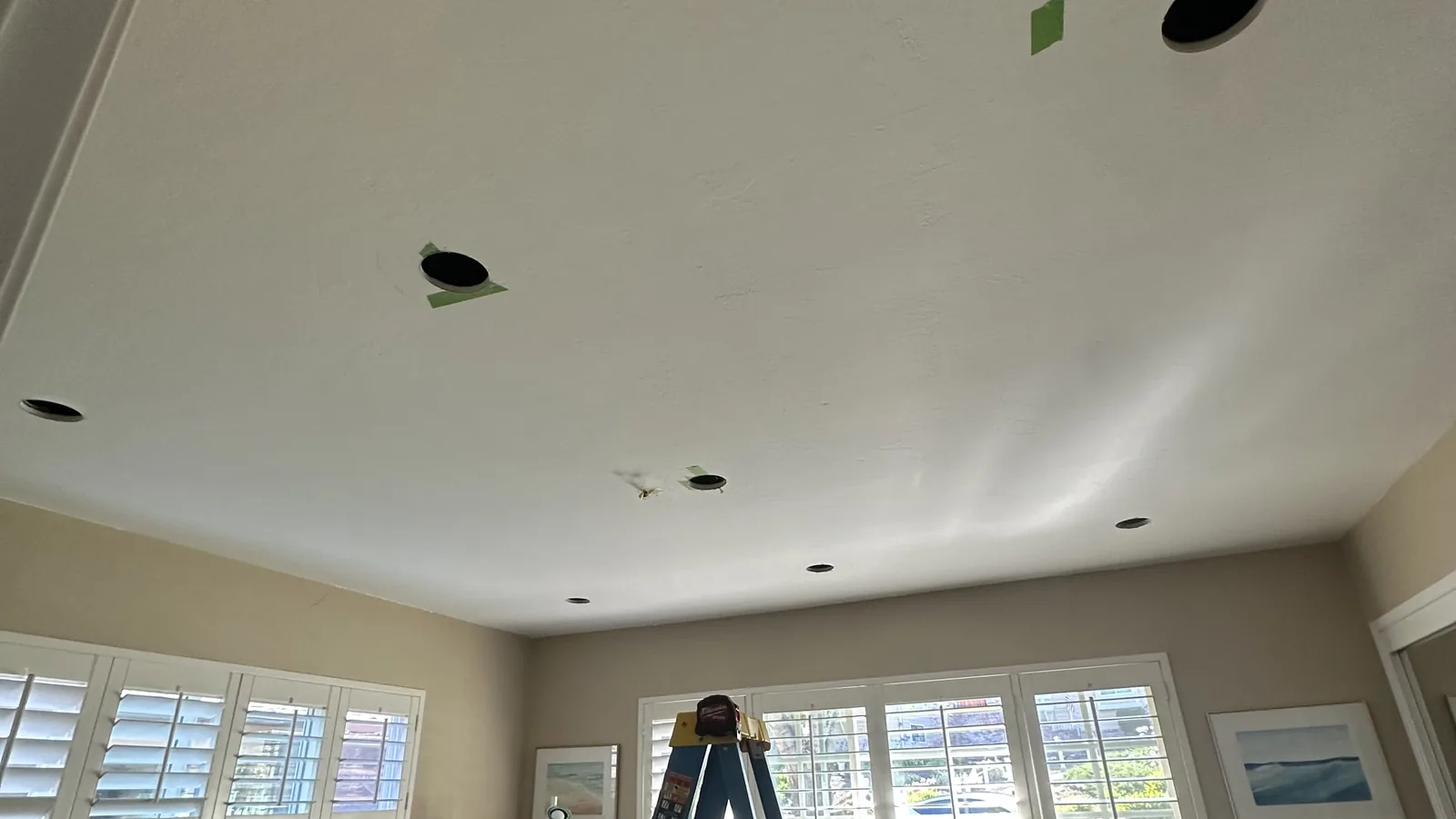 Ceiling openings cut for recessed lighting in a Sonoma County home office