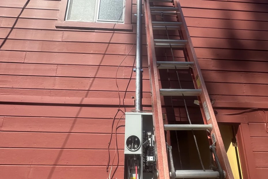 Completed service mast and weatherhead with utility drop on a Sonoma County home