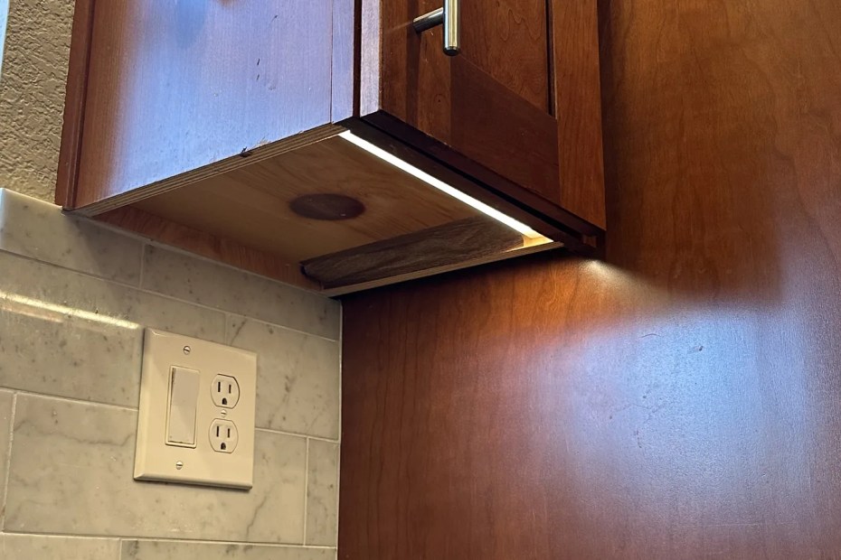Switch and receptacle controlling under-cabinet lighting in a Sonoma County kitchen