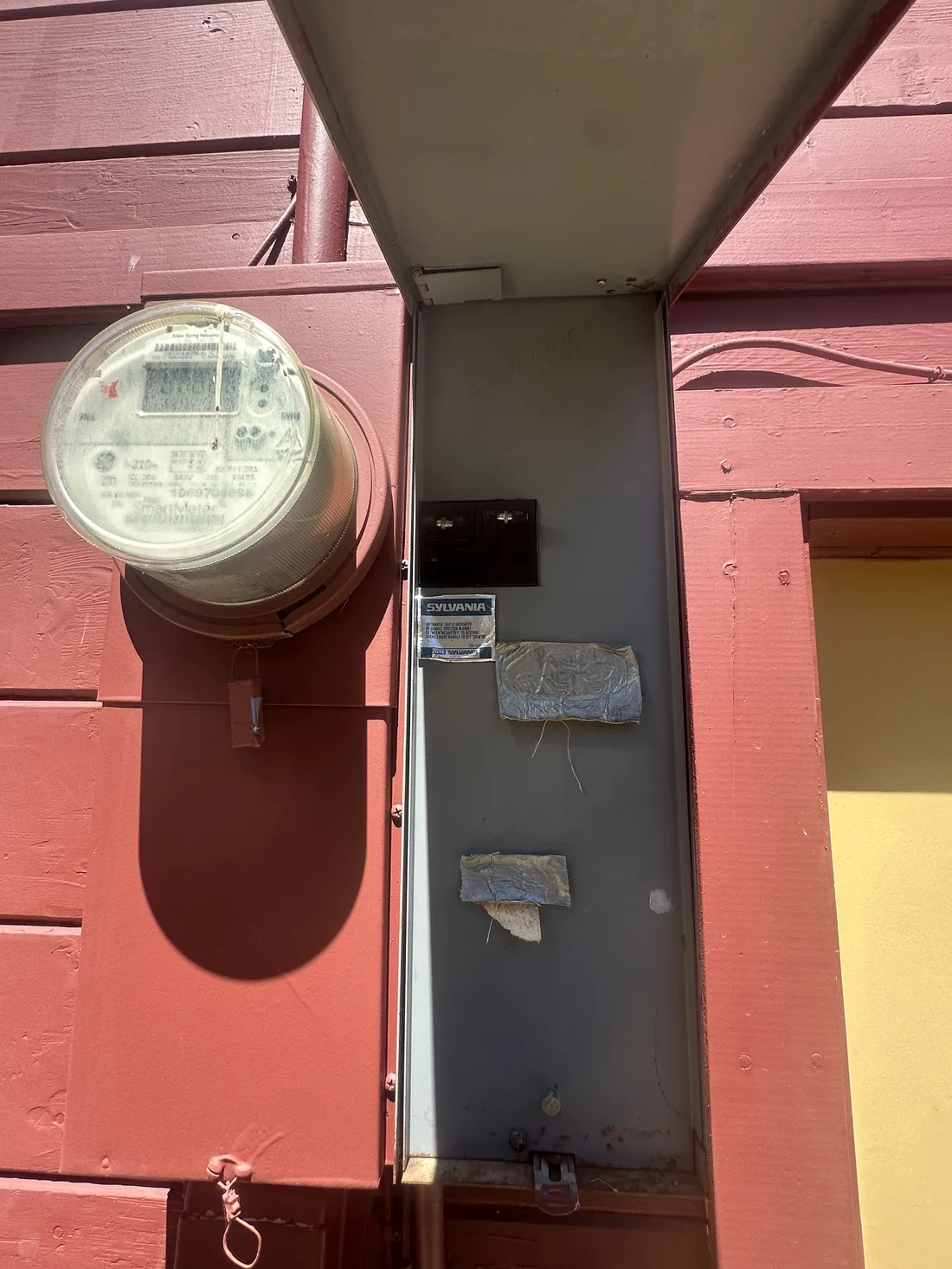 Existing utility meter and panel enclosure before a service upgrade in Sonoma County, CA